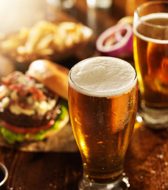 beer and burgers on wooden table